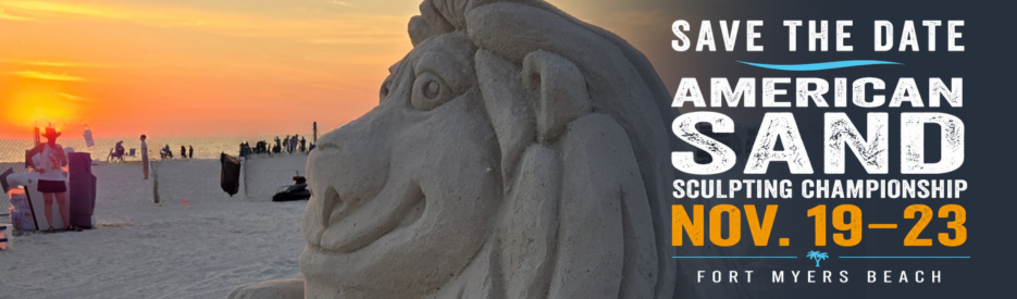 A detailed lion‑head sand sculpture on the beach at sunset with people walking nearby and event text promoting the American Sand Sculpting Championship.
