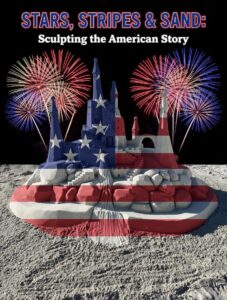 Sand castle sculpture in red, white, and blue with fireworks and text “Stars, Stripes & Sand.”