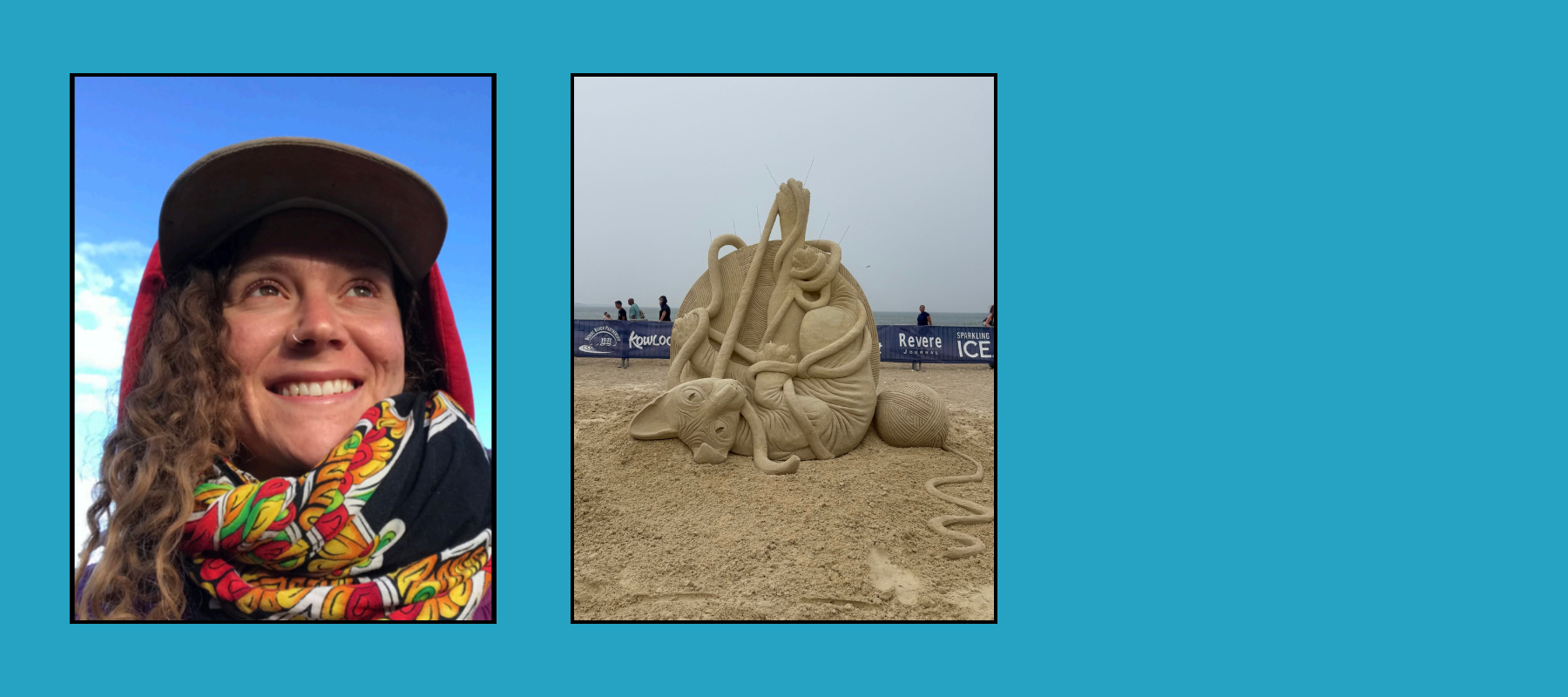 Smiling artist with curly hair and colorful scarf beside playful cat-and-yarn ball sand sculpture at beach festival.